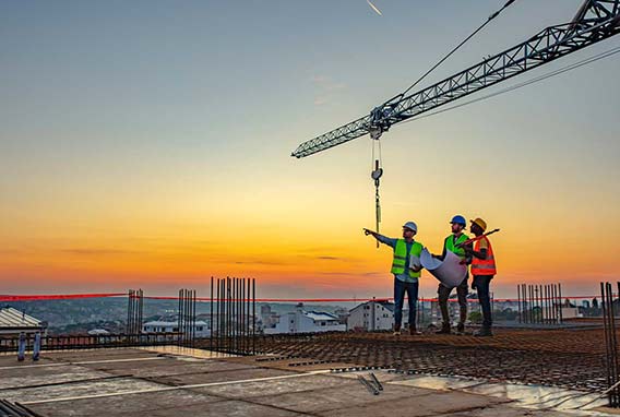 multi ethic workers talking at construction site